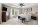 Comfortable main bedroom with natural light, a tray ceiling, and ample space at 6041 Laurent Ave, Fort Mill, SC 29715