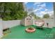Backyard space featuring a storage shed and egg chair in an enclosed yard at 636 Sadler Glen Dr, Charlotte, NC 28214