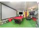 Recreational basement area with a pool table, projector screen and unique decor at 636 Sadler Glen Dr, Charlotte, NC 28214