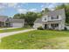Traditional two-story home with well-manicured lawn, long driveway and ample parking for residents and guests at 636 Sadler Glen Dr, Charlotte, NC 28214