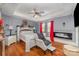 Comfortable main bedroom with a tray ceiling, fireplace, and stylish furnishings at 636 Sadler Glen Dr, Charlotte, NC 28214