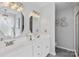 Elegant bathroom featuring a dual sink vanity with marble countertops and modern light fixtures at 6713 Edwards Farm Ln, Monroe, NC 28110