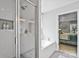 Bright bathroom with a tiled shower and a luxurious soaking tub adjacent to the primary bedroom at 6713 Edwards Farm Ln, Monroe, NC 28110