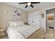 Tranquil bedroom featuring a ceiling fan, neutral walls, and direct bathroom access at 6713 Edwards Farm Ln, Monroe, NC 28110