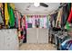 Organized walk-in closet with built-in shelving and drawers, providing ample storage space at 6713 Edwards Farm Ln, Monroe, NC 28110