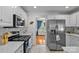 Well-equipped kitchen featuring stainless steel appliances and subway tile backsplash at 6713 Edwards Farm Ln, Monroe, NC 28110