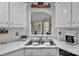 Bright kitchen sink featuring updated faucet and countertops at 6713 Edwards Farm Ln, Monroe, NC 28110