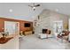 Open-concept living area with a fireplace, ample seating, and vaulted ceiling at 6713 Edwards Farm Ln, Monroe, NC 28110