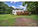 Expansive backyard with large deck perfect for entertaining with lush lawn at 7531 Linda Lake Dr, Charlotte, NC 28215