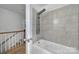Bathroom showing a modern shower tub combo with tiled walls and a multi-setting shower head at 7531 Linda Lake Dr, Charlotte, NC 28215