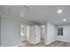 Bright bedroom features a closet with double doors, neutral paint, and wood-look floors at 7531 Linda Lake Dr, Charlotte, NC 28215