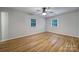 Bright bedroom with natural light, hardwood floors, and ceiling fan at 7531 Linda Lake Dr, Charlotte, NC 28215
