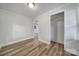 Bedroom showcasing wood-look floors, neutral paint, and an interior closet at 7531 Linda Lake Dr, Charlotte, NC 28215
