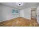Bedroom with a ceiling fan, large closet, hardwood floors, and an abundance of natural light at 7531 Linda Lake Dr, Charlotte, NC 28215