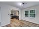 Dining area showcasing wood-look flooring and access to the kitchen at 7531 Linda Lake Dr, Charlotte, NC 28215