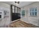 Inviting entryway with storage cabinets, window, and white painted door at 7531 Linda Lake Dr, Charlotte, NC 28215