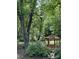 A cozy gazebo nestled in a lush wooded backyard at 7531 Linda Lake Dr, Charlotte, NC 28215