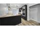 Beautifully updated kitchen with black cabinets, wood counters, and stainless appliances at 7531 Linda Lake Dr, Charlotte, NC 28215