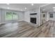 Inviting living room with a fireplace, wood floors, and plenty of space at 7531 Linda Lake Dr, Charlotte, NC 28215