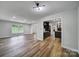 Living area showcasing wood-look floors and open access to the kitchen at 7531 Linda Lake Dr, Charlotte, NC 28215