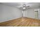 Spacious main bedroom with hardwood floors, neutral paint, and double closets at 7531 Linda Lake Dr, Charlotte, NC 28215