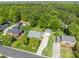 Stunning aerial view of a charming home with manicured lawn and lush greenery, offering privacy and curb appeal at 806 Mcgregor Ne Dr, Concord, NC 28025