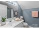 Bright bathroom with a modern vanity, tiled shower, and fresh towels for a clean, updated look at 806 Mcgregor Ne Dr, Concord, NC 28025