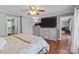 Spacious primary bedroom with hardwood floors, ceiling fan, and natural light at 806 Mcgregor Ne Dr, Concord, NC 28025