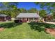Lovely single-story home with a groomed lawn, inviting front porch, and beautiful landscaping at 806 Mcgregor Ne Dr, Concord, NC 28025