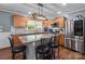 Modern kitchen with an island, granite countertops, and stainless steel appliances at 806 Mcgregor Ne Dr, Concord, NC 28025