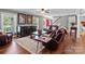 Comfortable living room with large sofas, a decorative rug, and staircase at 806 Mcgregor Ne Dr, Concord, NC 28025