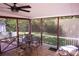 Enjoy the serene views of the expansive backyard from the screened porch, complete with a cozy seating area at 854 Silver Fox Dr, Concord, NC 28025