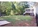 This grassy backyard features a screened in back porch and would be perfect for entertaining or relaxing at 854 Silver Fox Dr, Concord, NC 28025