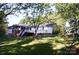 Expansive backyard featuring a deck, screened porch and space for outdoor activities at 854 Silver Fox Dr, Concord, NC 28025