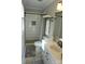 This bright bathroom features an updated shower with tile surround, vanity, and soft, neutral tones at 854 Silver Fox Dr, Concord, NC 28025