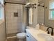 Stylish bathroom featuring tiled shower, decorative accents, neutral wall color and a white vanity at 854 Silver Fox Dr, Concord, NC 28025