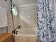 Stylish bathtub with a floral shower curtain and modern fixtures at 854 Silver Fox Dr, Concord, NC 28025