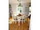Cozy dining area with a classic table setting, natural light, and stylish decor, ideal for Gathering meals at 854 Silver Fox Dr, Concord, NC 28025
