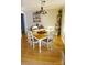 Well-lit dining area showcasing a table with seating for four, complemented by hardwood floors and elegant decor at 854 Silver Fox Dr, Concord, NC 28025