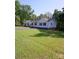Beautiful ranch home with an expansive green lawn, mature trees, and a well-maintained exterior at 854 Silver Fox Dr, Concord, NC 28025