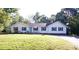 Charming one-story home featuring a well-manicured lawn and a inviting blue front door, creating a welcoming curb appeal at 854 Silver Fox Dr, Concord, NC 28025
