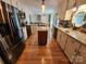 Open kitchen with a large island, stainless steel appliances, and access to the dining room at 854 Silver Fox Dr, Concord, NC 28025