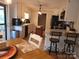 Cozy eat-in kitchen with white cabinets, granite countertops, and modern appliances at 854 Silver Fox Dr, Concord, NC 28025