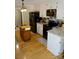 Well-appointed kitchen featuring granite countertops, black appliances, white cabinetry, and functional movable island at 854 Silver Fox Dr, Concord, NC 28025