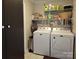 Functional laundry room with washer, dryer, and shelving at 854 Silver Fox Dr, Concord, NC 28025