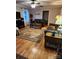 Inviting living room features hardwood floors, a ceiling fan, and comfortable leather furniture at 854 Silver Fox Dr, Concord, NC 28025