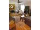 Cozy living room with hardwood floors, brick fireplace, and comfortable seating arrangement, perfect for relaxation at 854 Silver Fox Dr, Concord, NC 28025
