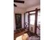 Inviting porch with classic accents, featuring a fan, dual entry doors, and cozy seating, perfect for relaxing outdoors at 854 Silver Fox Dr, Concord, NC 28025