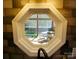 Unique octagon-shaped window offers a picturesque view of the screened-in porch at 854 Silver Fox Dr, Concord, NC 28025