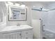 Bathroom featuring a shower with glass doors, tiled walls, sink, and mirror at 101 Wynnchester Rd, Gastonia, NC 28056